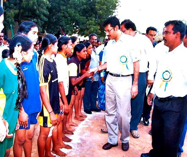Chief guest greeting young players at the tournament